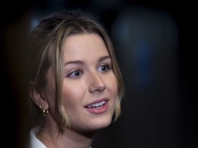 Charlotte Bouchard, sister of tennis star Eugenie Bouchard, addresses reporters at the Montreal courthouse Thursday.