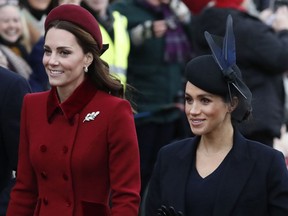In this Dec. 25, 2018 file photo, Britain's Kate, Duchess of Cambridge, left, and Meghan, Duchess of Sussex, arrive to attend the Christmas day service at St Mary Magdalene Church in Sandringham in Norfolk, England.
