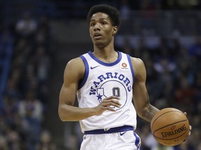 In this Jan. 12, 2018 file photo, Golden State Warriors' Patrick McCaw dribbles during the first half of an NBA basketball game against the Milwaukee Bucks in Milwaukee.