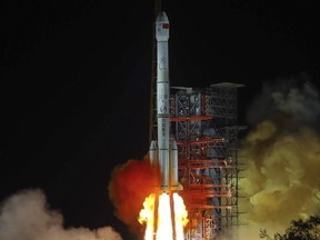 In this Dec. 8, 2018, file photo, and released by Xinhua News Agency, the Chang'e 4 lunar probe launches from the the Xichang Satellite Launch Center in southwestern China's Sichuan province.