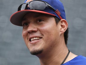 This June 27, 2018, file photo shows New York Mets' Wilmer Flores (4) before a baseball game against the Pittsburgh Pirates in New York.