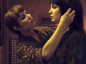 This image released by Netflix shows Noomi Rapace, left, and Sophie Nélisse in a scene from "Close." Rapace portrays a counter-terrorism expert and bodyguard who gets enlisted to protect a spoiled heiress from some dangerous people out for her fortune.