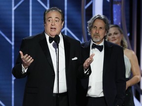 FILE - In this Jan. 6, 2019 file image released by NBC, Nick Vallelonga accepts the award for best screenplay for "Green Book" during the 76th annual Golden Globe Awards at the Beverly Hilton Hotel in Beverly Hills, Calif. Vallelonga apologized Thursday, Jan. 10 for a 2015 tweet about Muslims and 9/11 that has resurfaced. In the tweet, he said then-presidential-candidate Donald Trump was correct that television news on 9/11 showed Muslims in Jersey City cheering and he had seen it. There's no evidence such celebrations occurred.