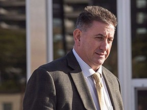 Former gymnastics coach Dave Brubaker leaves the court house in Sarnia, Ont., Tuesday, October 23, 2018 following the first day of testimony in his sexual assault trial. Elizabeth Brubaker was provisionally suspended as a coach by Gymnasitics Canada on Monday, following a number of written complaints to the national governing body about her conduct. Her husband Dave Brubaker, who was the director of the women's national gymnastics team, has pleaded not guilty to one count of sexual assault and one count of sexual exploitation in an ongoing criminal trial.