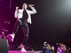 Hedley lead singer Jacob Hoggard performs in Kelowna, B.C. on March 23, 2018. Embattled Hedley frontman Jacob Hoggard wed Canadian actress Rebekah Asselstine in Vancouver on New Year's Eve.