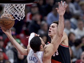 Portland Trail Blazers forward Zach Collins, right, shoots over New York Knicks center Enes Kanter during the second half of an NBA basketball game in Portland, Ore., Monday, Jan. 7, 2019.