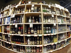 This June 16, 2016, file photo, taken with a fisheye lens, shows bottles of alcohol during a tour of a state liquor store, in Salt Lake City. (AP Photo/Rick Bowmer, File)