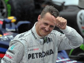 In this file photo taken on November 25, 2012 German Formula One driver Michael Schumacher gives the thumb up at the end of the Brazil's F-1 GP at the Interlagos racetrack in Sao Paulo, Brazil. (YASUYOSHI CHIBA/AFP/Getty Images)