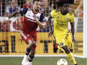 FC Dallas forward Maximiliano Urruti, left, and Columbus Crew defender Lalas Abubakar battle for possession of the ball during the first half of an MLS soccer match, Saturday, Sept. 15, 2018, in Frisco, Texas.
