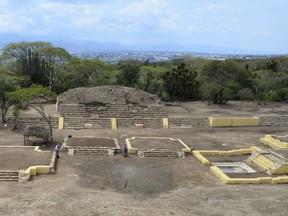 In this 2018 photo provided by Mexico's National Institute of Anthropology and History, INAH, investigators work at the Ndachjian–Tehuacan archaeological site in Tehuacan, Mexico.