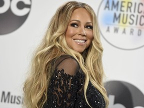 In this Oct. 9, 2018 file photo, Mariah Carey poses in the press room at the American Music Awards at the Microsoft Theater in Los Angeles.
