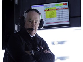 In this Jan. 26, 2019, file photo, Penske Acura team owner Roger Penske monitors his Acura DPi cars on the track from his pit stall at the IMSA 24-hour race at Daytona International Speedway in Daytona Beach, Fla. Penske's drivers swept all the races at Indianapolis Motor Speedway and his reward has been induction into the NASCAR Hall of Fame. Penske will be honored Friday night along with Jeff Gordon, deceased drivers Davey Allison and Alan Kulwicki and fellow team owner Jack Roush.