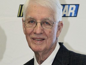 In this Jan. 20, 2012, file photo, Glen Wood poses for photos as he arrives at the NASCAR Hall of Fame induction ceremonies in Charlotte, N.C. Glen Wood, patriarch of the famed Wood Brothers Racing team and the oldest living member of the NASCAR Hall of Fame, has died after a long illness, in Stuart, Virginia. He was 93. "It's with profound sadness that we mourn the passing of team founder and family patriarch Glen Wood this morning," The Wood Brothers posted on social media Friday morning, Jan. 19, 2019.