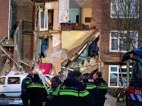Authorities respond after a three-storey home collapsed in The Hague, Netherlands on Sunday, Jan. 27, 2019.