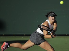 Bianca Andreescu returns a shot to Eugenie Bouchard during their quarterfinal at the Oracle Challenger Series tennis tournament Friday, Jan. 25, 2019, in Newport Beach, Calif.