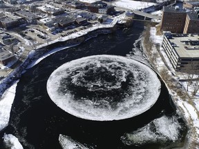 In this Monday, Jan. 14, 2019 aerial image taken from a drone video and provided by the City of Westbrook, Maine, a naturally occurring ice disk forms on the Presumpscot River in Westbrook, Maine.