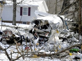 Debris lies on the ground after a deadly plane crash near Kidron, Ohio, Monday, Jan. 21, 2019.