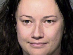 This undated booking photo provided by Maricopa County (Ariz.) Sheriff's Office shows Jacqueline Claire Ades. Authorities say the Phoenix woman became obsessed with a man she met after only one date, sending him more than 65,000 text messages and breaking into his home. Ades remained jailed Friday, May 11, 2018, on charges of stalking, threatening and harassment by communication. (Maricopa County Sheriff's Office via AP) ORG XMIT: NYCD501