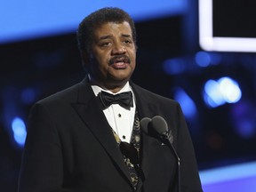 In this Jan. 28, 2018, file photo, Neil deGrasse Tyson speaks at the 60th annual Grammy Awards at Madison Square Garden in New York.