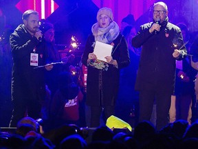 Gdansk Mayor Pawel Adamowicz, far right, speaks to an audience shortly before he was stabbed in Gdansk, Poland, on Sunday Jan. 13, 2019.