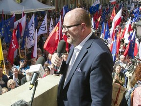 In this Saturday, April 21, 2018 file photo, the mayor of Gdansk, Pawel Adamowicz addresses a rally organized in protest against a recent gathering by far-right groups in this Baltic coast city, in Gdansk, Poland.