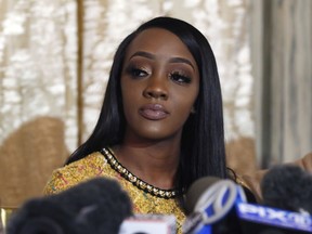 Faith Rodgers, left, appears during a news conference about singer R. Kelly in New York, Monday, Jan. 14, 2019.