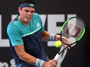 Milos Raonic hits a return against Miomir Kecmanovic during their match at the Brisbane International in Brisbane on January 2, 2019. (SAEED KHAN/AFP/Getty Images)