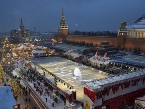 Red Square decorated for New Year celebrations is seen from a roof of the Moscow GUM State Department store in Moscow, Russia, Saturday, Dec. 22, 2018. (AP Photo/Alexander Zemlianichenko, Pool)