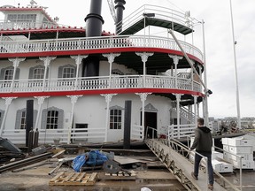 In this Nov. 29, 2018, photo, Matt Dow, project manager for the restoration of the "City of New Orleans" riverboat, walks on the vessel in New Orleans. (AP Photo/Gerald Herbert)