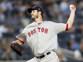 Boston Red Sox starting pitcher Drew Pomeranz winds up during the second inning of a baseball game against the New York Yankees in New York, Tuesday, May 8, 2018.