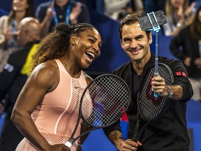 Serena Williams and Roger Federer take a selfie after their mixed doubles match at the Hopman Cup in Perth January 1, 2019. (TONY ASHBY/AFP/Getty Images)