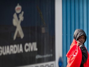 A migrant is transferred at the Centre for Temporary Assistance to Foreigners (CATE) in San Roque, after arriving on board the Spanish NGO Proactiva Open Arms in the southern Spanish port of Algeciras in Campamento near San Roque, with 311 migrants on board,on December 28, 2018. (JORGE GUERRERO/AFP/Getty Images)