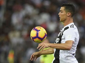 Juventus' Cristiano Ronaldo controls the ball during the Italian Super Cup final soccer match against AC Milan at King Abdullah stadium in Jiddah, Saudi Arabia, Wednesday, Jan. 16, 2019. (AP Photo)