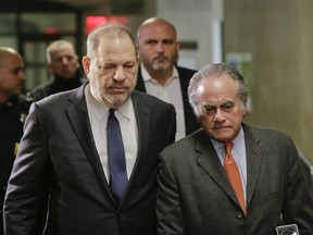 In this Dec. 20, 2018 file photo, Harvey Weinstein, left, arrives at New York Supreme Court with his attorney Benjamin Brafman in New York.