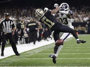 In this Sunday, Jan. 20, 2019 file photo, New Orleans Saints wide receiver Tommylee Lewis (11) works for a catch against Los Angeles Rams defensive back Nickell Robey-Coleman (23) during the second half the NFL football NFC championship game, in New Orleans. The Rams won 26-23.