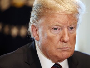 President Donald Trump attends a roundtable discussion on border security with local leaders, Friday Jan. 11, 2019, in the Cabinet Room of the White House in Washington.