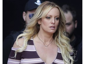 In this Oct. 11, 2018, file photo, adult film actress Stormy Daniels arrives for the opening of the adult entertainment fair "Venus" in Berlin.
