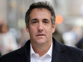 In this April 11, 2018, file photo, Michael Cohen, U.S. President Donald Trump's former attorney, walks along a sidewalk in New York.
