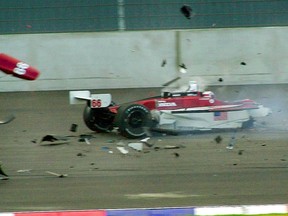 In this Sept. 15, 2001, file photo, Italian driver Alex Zanardi's car breaks up after it crashed with Canadian driver Alex Tagliani during the CART auto race at the Eurospeedway Lausitz in Klettwitz, Germany. (AP Photo/Eckehard Schulz, File)