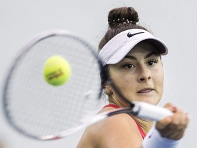 Bianca Andreescu of Canada returns to Lesia Tsurenko of Ukraine during their Fed Cup tennis match in Montreal, Saturday, April 21, 2018.