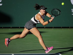 Bianca Andreescu returns a shot to Eugenie Bouchard during their quarterfinal at the Oracle Challenger Series tennis tournament Friday, Jan. 25, 2019, in Newport Beach, Calif.