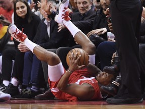 Toronto Raptors guard Kyle Lowry falls out of bounds with the ball against the Indiana Pacers during first half NBA basketball action in Toronto on Sunday, Jan. 6, 2019.