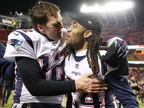 Tom Brady of the New England Patriots celebrates with teammate Stephon Gilmore after defeating the Kansas City Chiefs in overtime at Arrowhead Stadium on January 20, 2019 in Kansas City. (Patrick Smith/Getty Images)