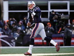 New England Patriots quarterback Tom Brady celebrates his touchdown pass to Phillip Dorsett during the first half of an NFL divisional playoff football game against the Los Angeles Chargers, Sunday, Jan. 13, 2019, in Foxborough, Mass.
