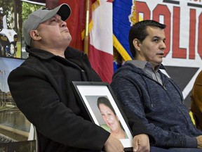 An emotional Trevor Miller holds a portrait of his sister, Melissa Miller during a news conference on the Six Nations of the Grand River Territory on Thursday November 15, 2018. Melissa Miller was one of three Six Nations residents found slain in the Municipality of Middlesex Centre, near London, earlier this month. Brian Thompson/Brantford Expositor/Postmedia Network