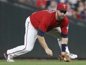 Minnesota Twins' Brian Dozier grabs a line drive Monday, July 30, 2018 in Minneapolis. (AP Photo/Stacy Bengs)