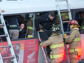 First responders attend to victims of a horrific rush-hour bus crash at the Westboro Station near Tunney's Pasture on Friday, Jan. 11, 2019.