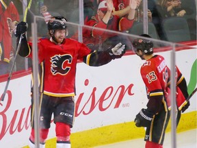 Calgary Flames Elias Lindholm, left and Johnny Gaudreau celebrate after teaming up to score their second goal during NHL action against the Minnesota Wild at the Scotiabank Saddledome in Calgary on Thursday December 6, 2018. Gaudreau assisted on both of Lindholm's goals. Gavin Young/Postmedia