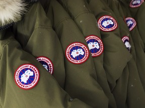 Jackets hang at the factory of Canada Goose Inc. in Toronto on November 28, 2013. (THE CANADIAN PRESS/Aaron Vincent Elkaim)
