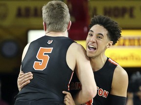 Princeton guard Devin Cannady, right, and teammate Drew Friberg (5) celebrate following a victory over Arizona State Saturday, Dec. 29, 2018, in Tempe, Ariz. (AP Photo/Ralph Freso)